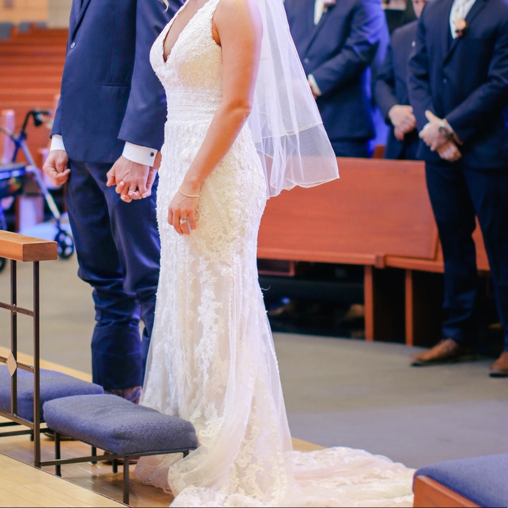 Ivory lace wedding dress.